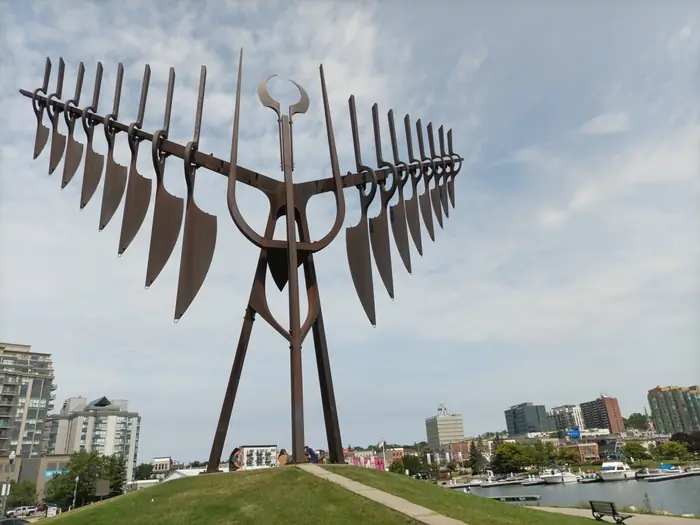 Mowed grass hill under the Spirit Catcher on the Barrie waterfront, the kind of clean edge the best landscaper in Barrie should leave