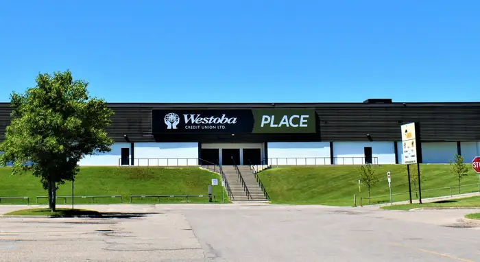Mowed green slopes in front of the Keystone Centre arena, the kind of neat grass people hire the best landscaper in Brandon for