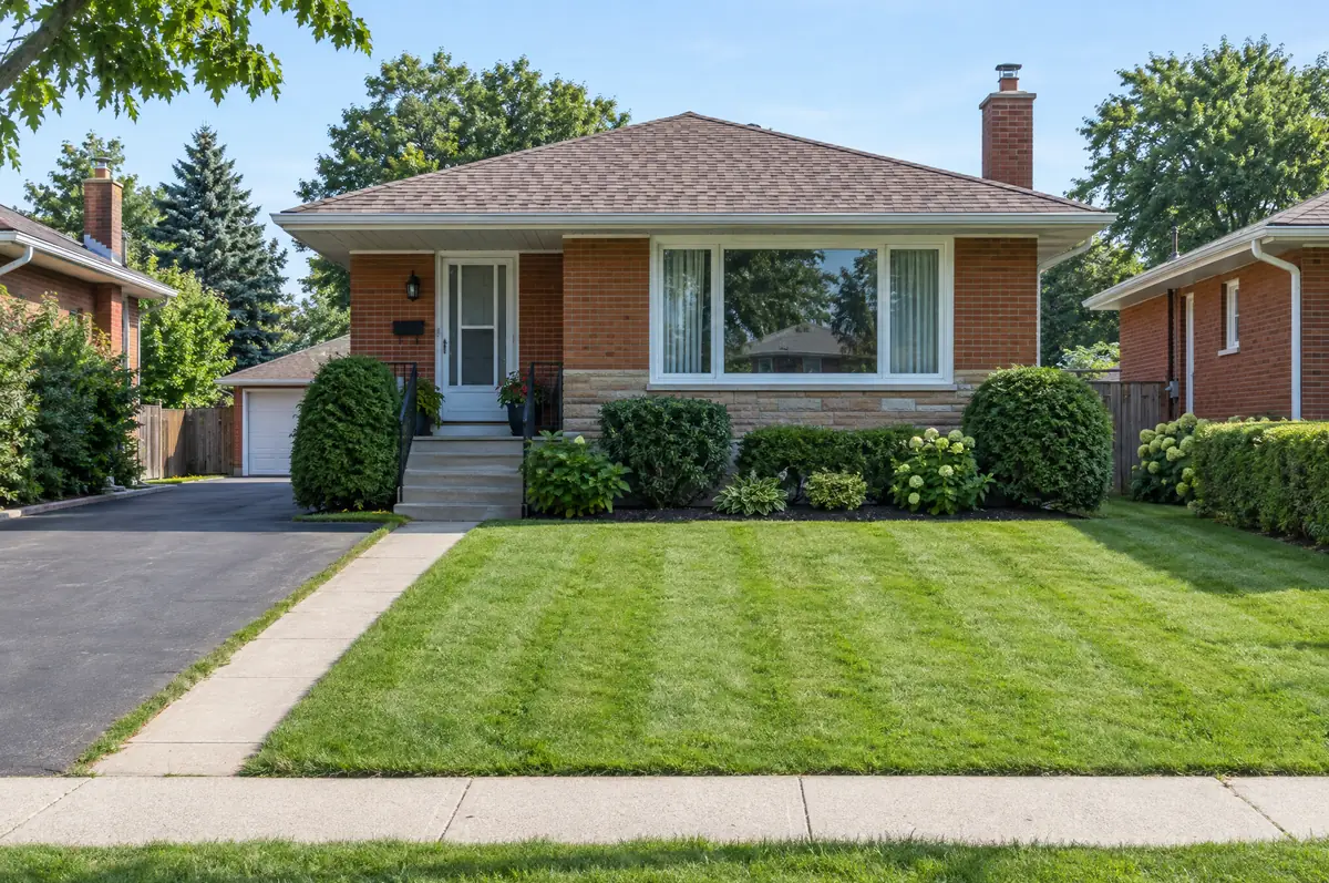 After: the same lawn cut to an even height with light stripes and clean edges