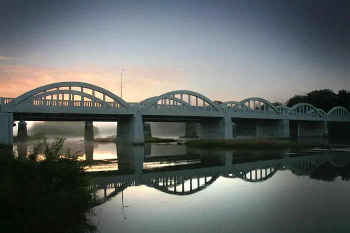 The arched Freeport Bridge crossing the Grand River in Kitchener at dawn