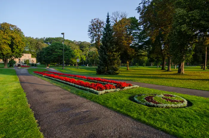 Mowed lawns and flower beds in Queen Victoria Park, the kind of finish the best landscaper in Niagara Falls aims for at home