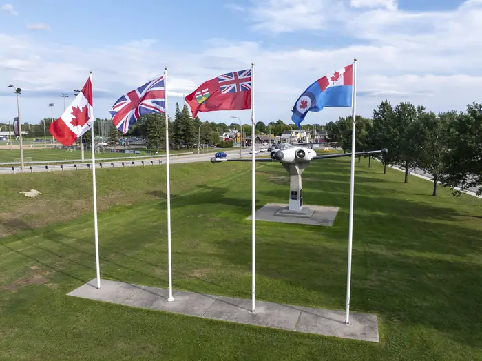 Flags and a wide mowed lawn at Lee Park, the kind of grass people hire the best landscaper in North Bay to keep