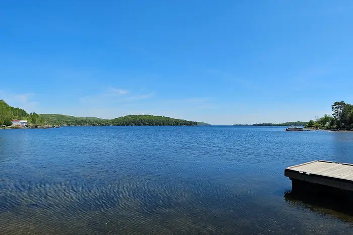 Calm water and wooded hills on Trout Lake, North Bay's drinking water source