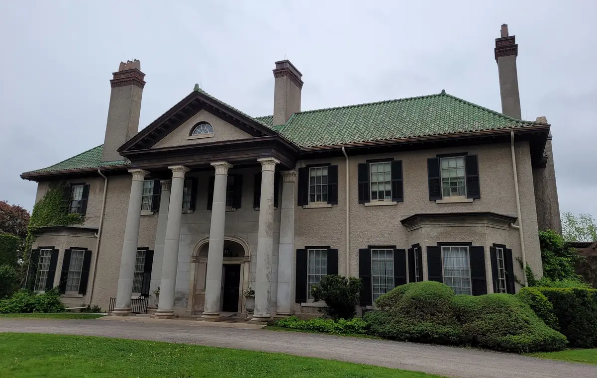 Parkwood Estate in Oshawa with its front lawn and clipped shrubs