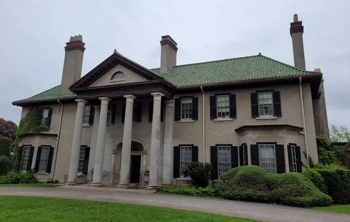 Parkwood Estate in Oshawa with its front lawn and clipped shrubs, a yard worthy of the best landscaper in Oshawa