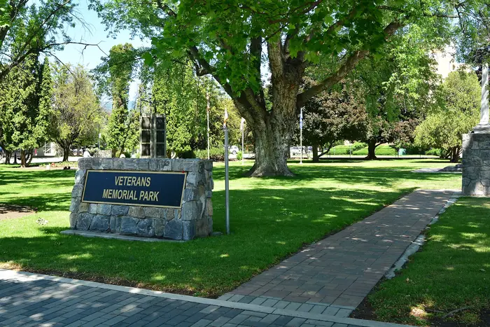 Green, mowed grass and shade trees at Veterans Memorial Park, the kind of lawn people want from the best landscaper in Penticton
