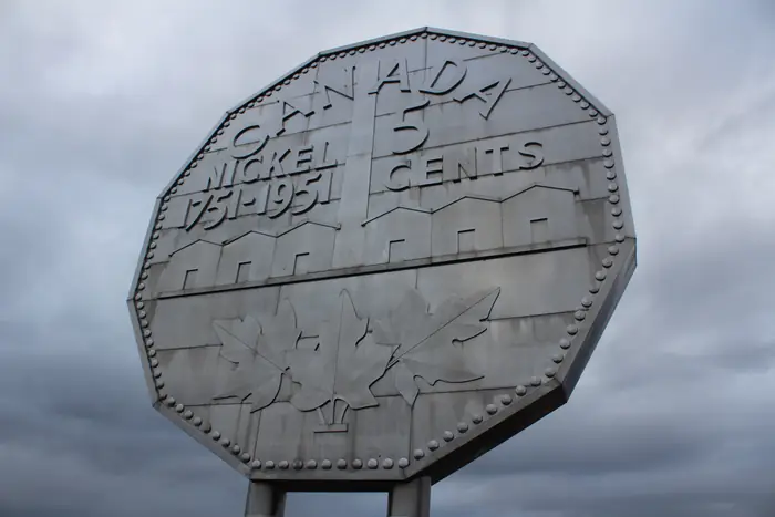 The Big Nickel at Dynamic Earth in Sudbury under a grey sky