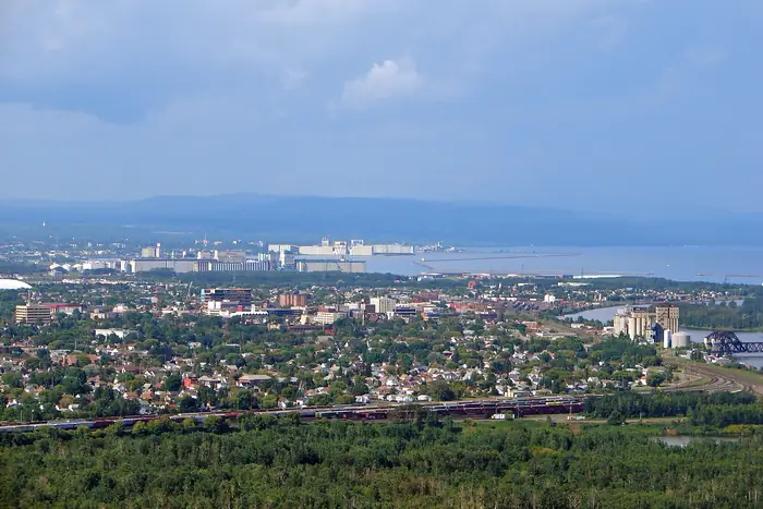 Thunder Bay's houses, trees and harbour seen from Mount McKay