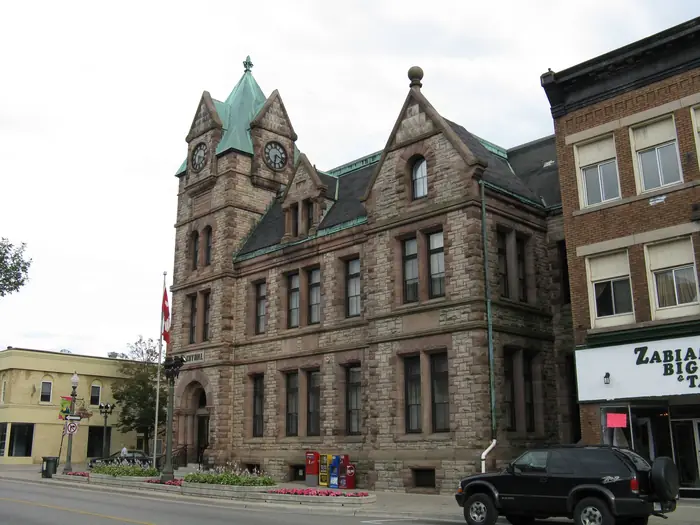 Woodstock City Hall, a red stone building with a clock tower